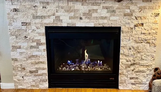 After: Amber fire glass and new panel