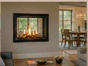 See-through gas fireplace spanning an interior wall